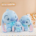 STITCH AZUL CLARO SENTADO 45CM COD PELUCHE132B STITCH AZUL CLARO SENTADO 45CM COD PELUCHE132B